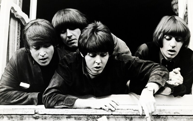 The Beatles at a window