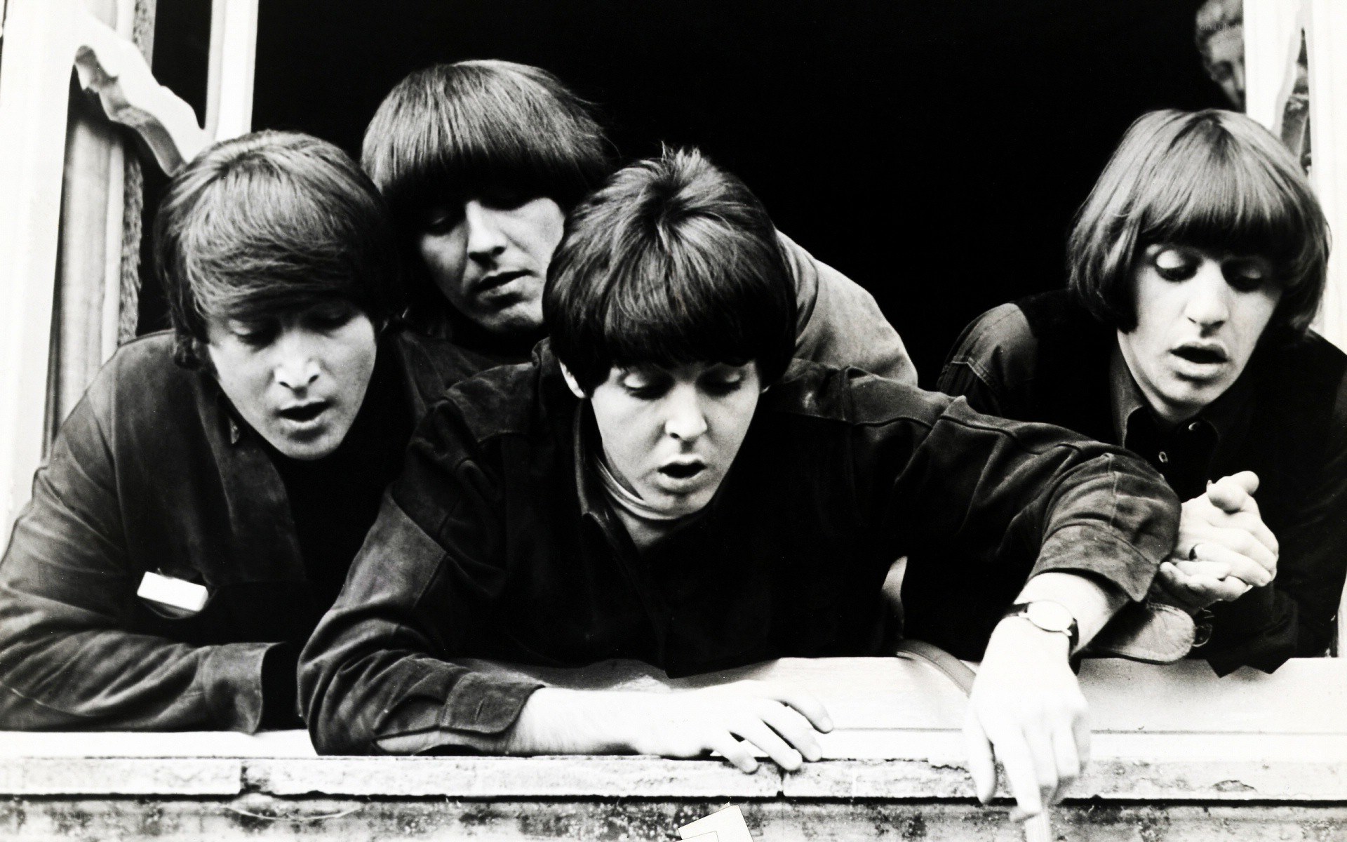 The Beatles at a window