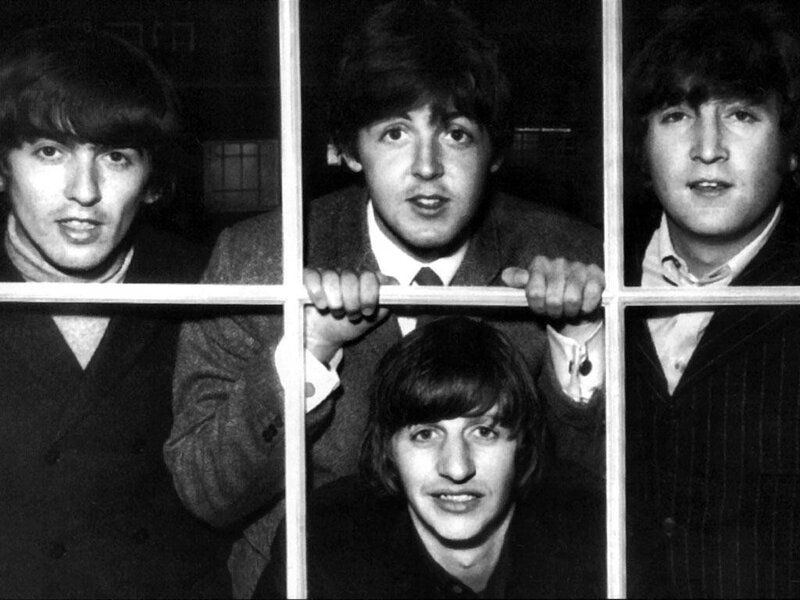 The Beatles at a window