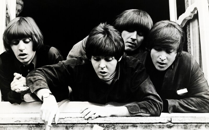 The Beatles at a window