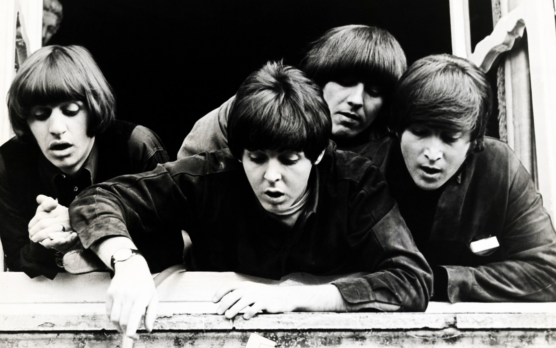 The Beatles at a window