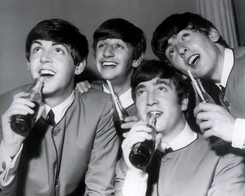 The Beatles drinking soda
