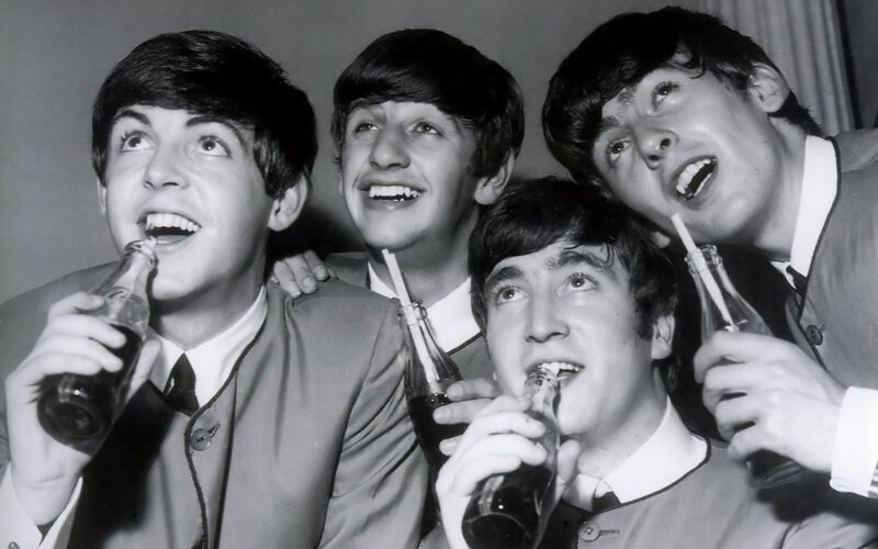 The Beatles drinking soda