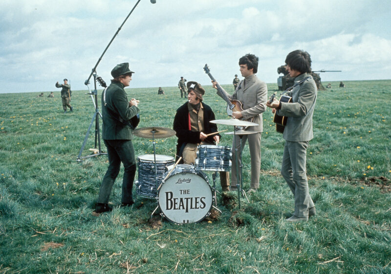 The Beatles in a field