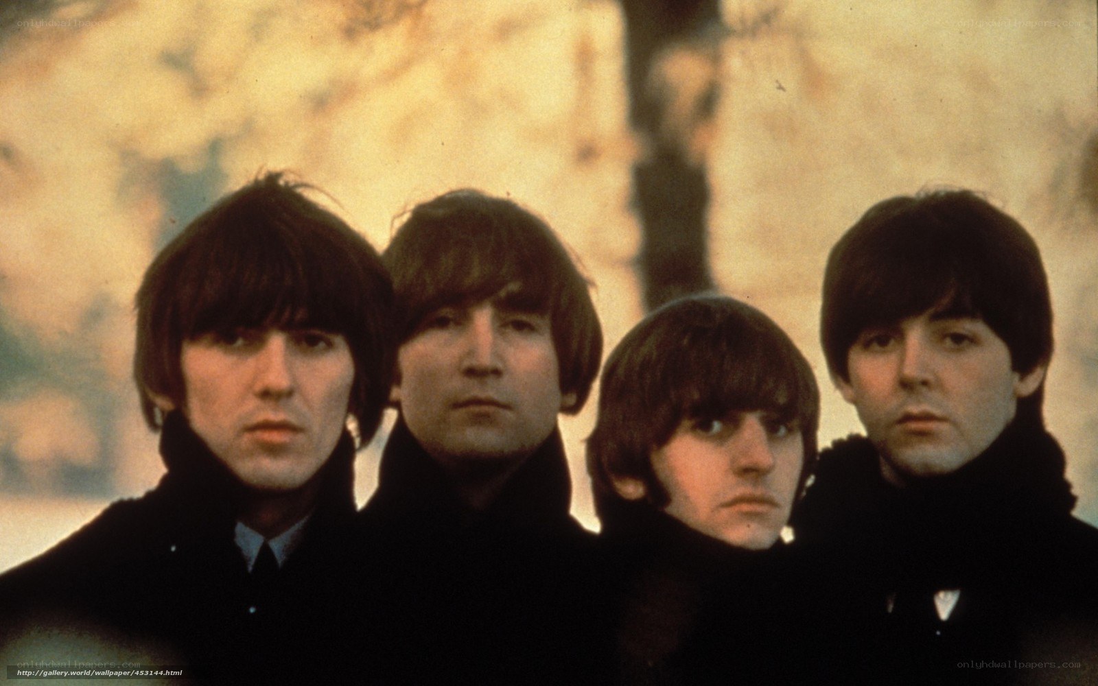 The Beatles in black coats