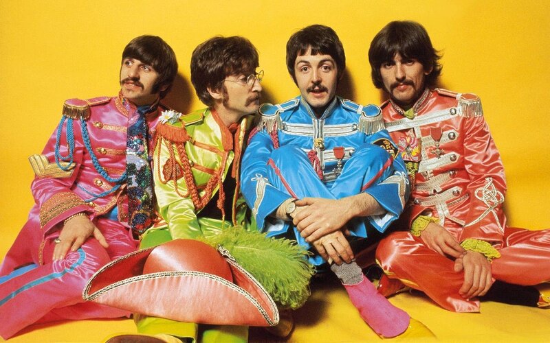 The Beatles in colorful uniforms