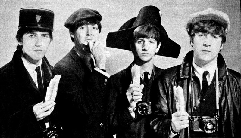 The Beatles in hats and cameras