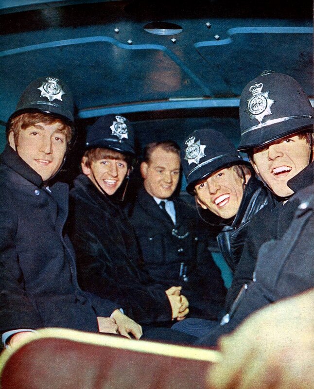 The Beatles in police uniforms