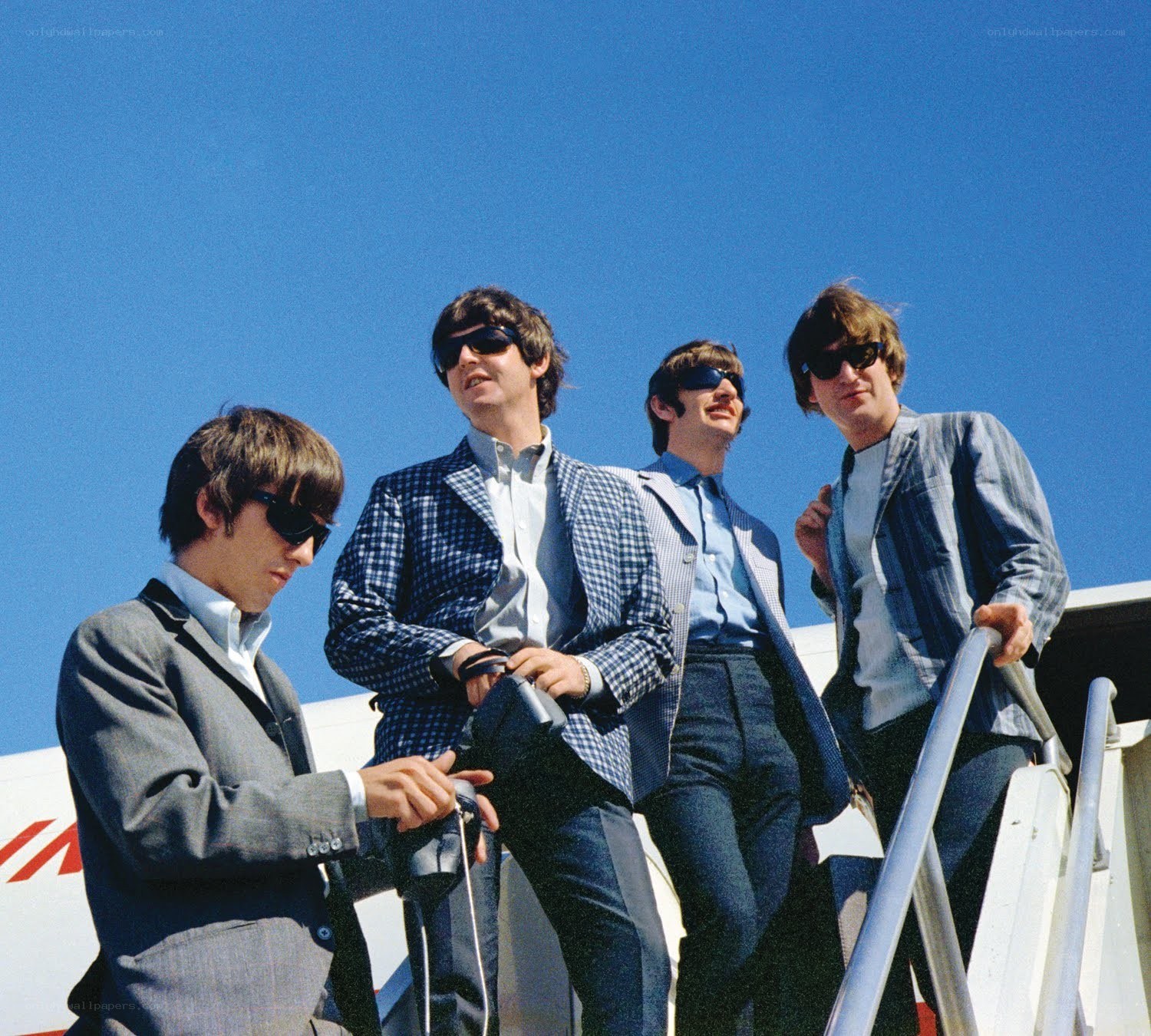 The Beatles on an airplane