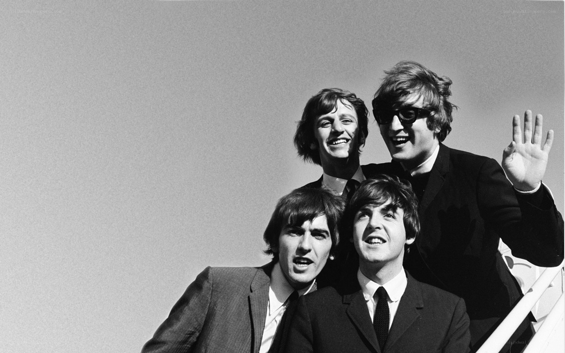The Beatles on an airplane