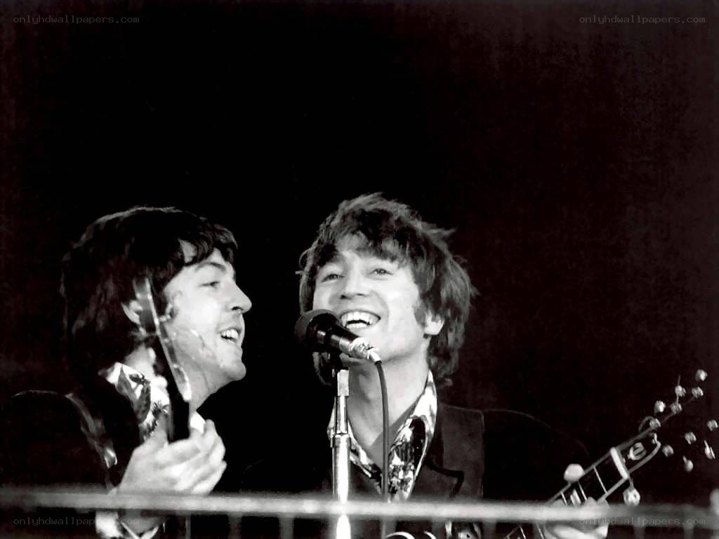 The Beatles performing on stage