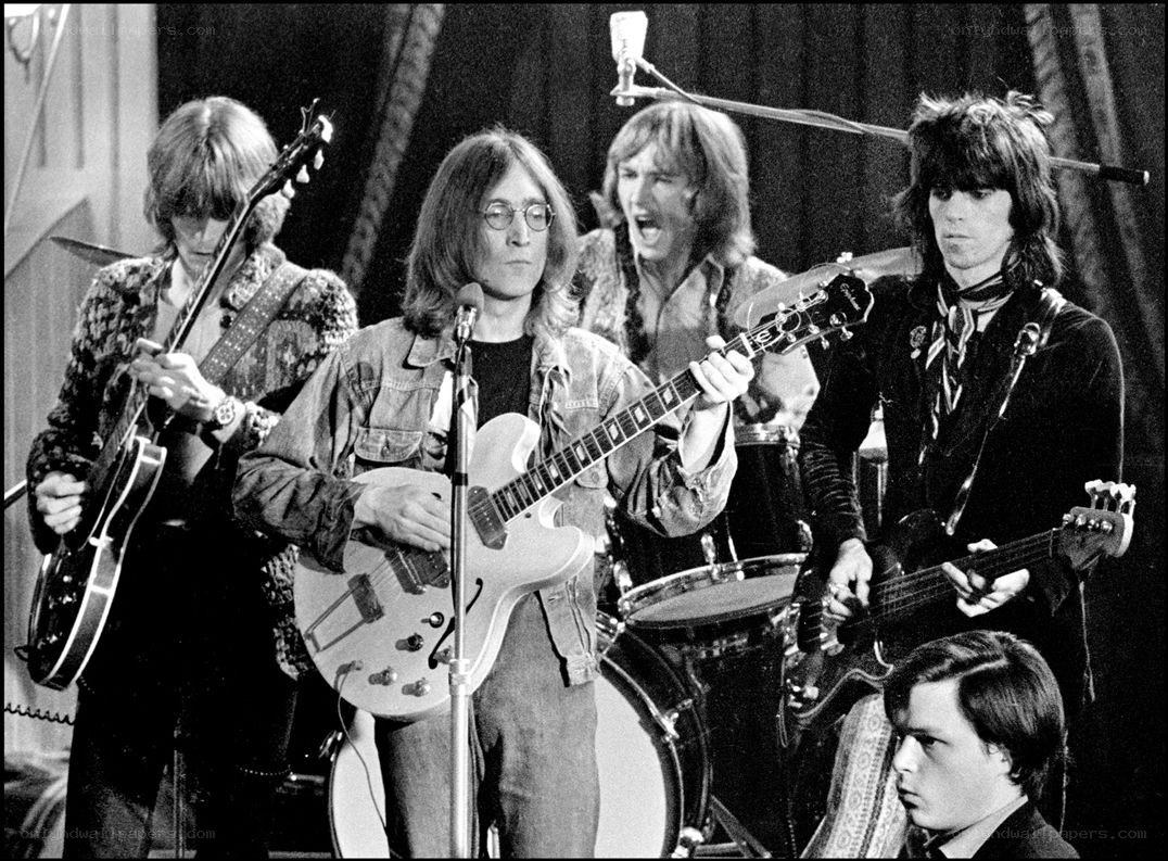 The Beatles performing on stage