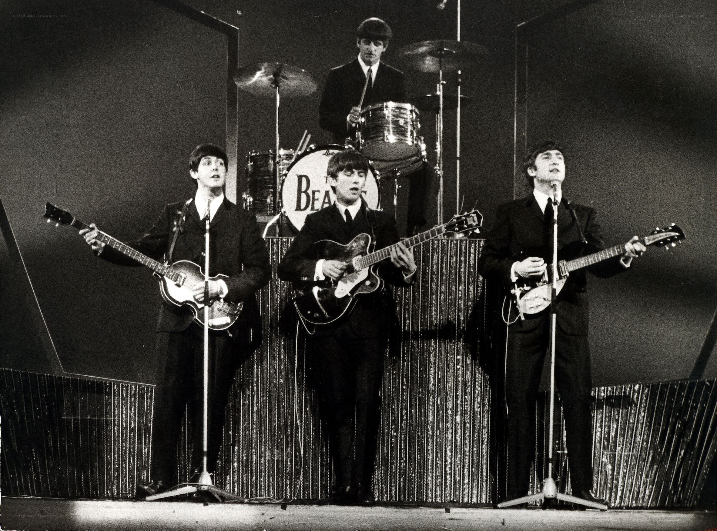 The Beatles performing on stage