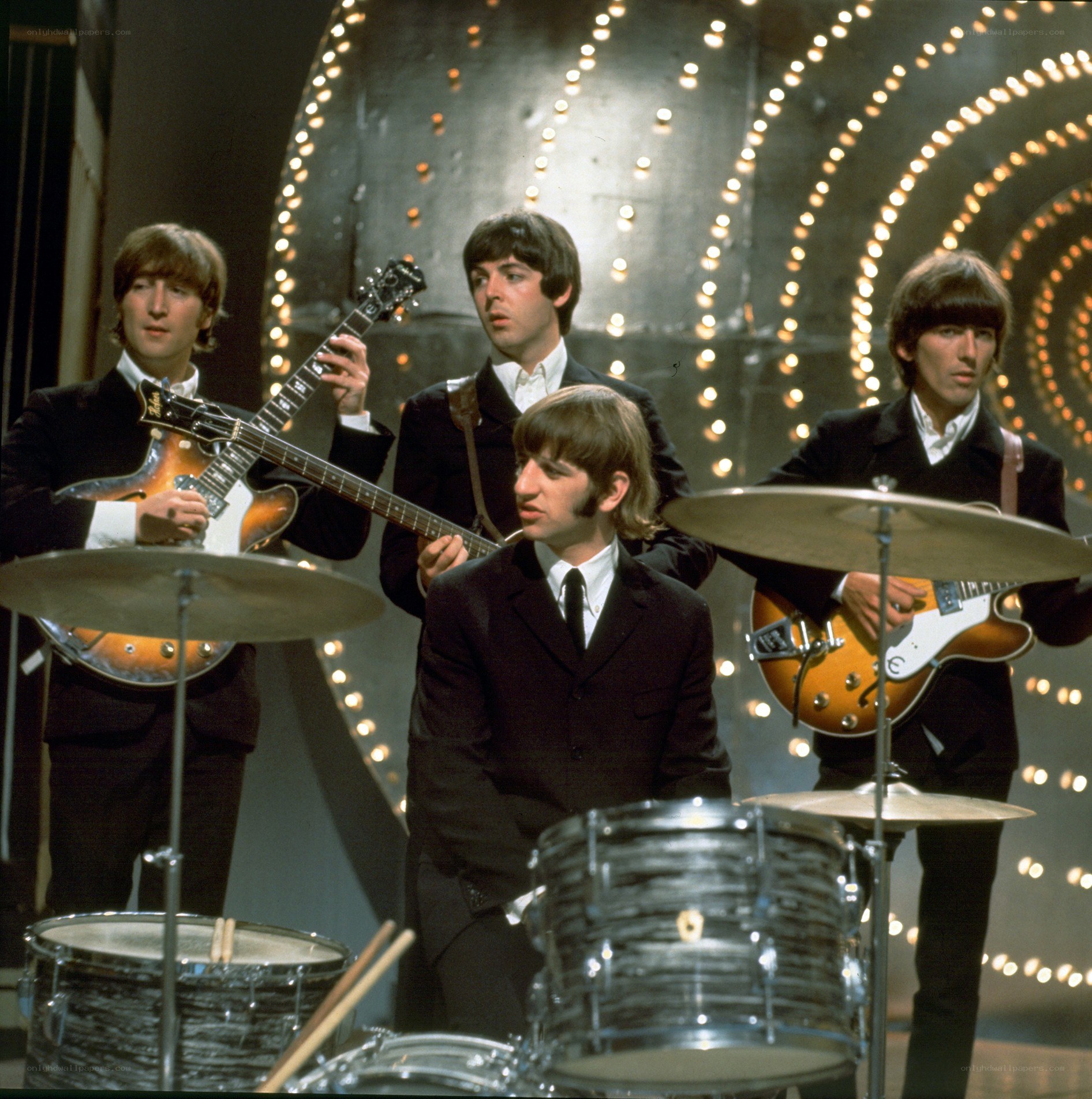The Beatles performing on stage