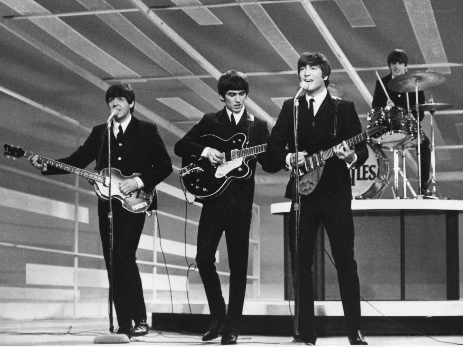The Beatles performing on stage