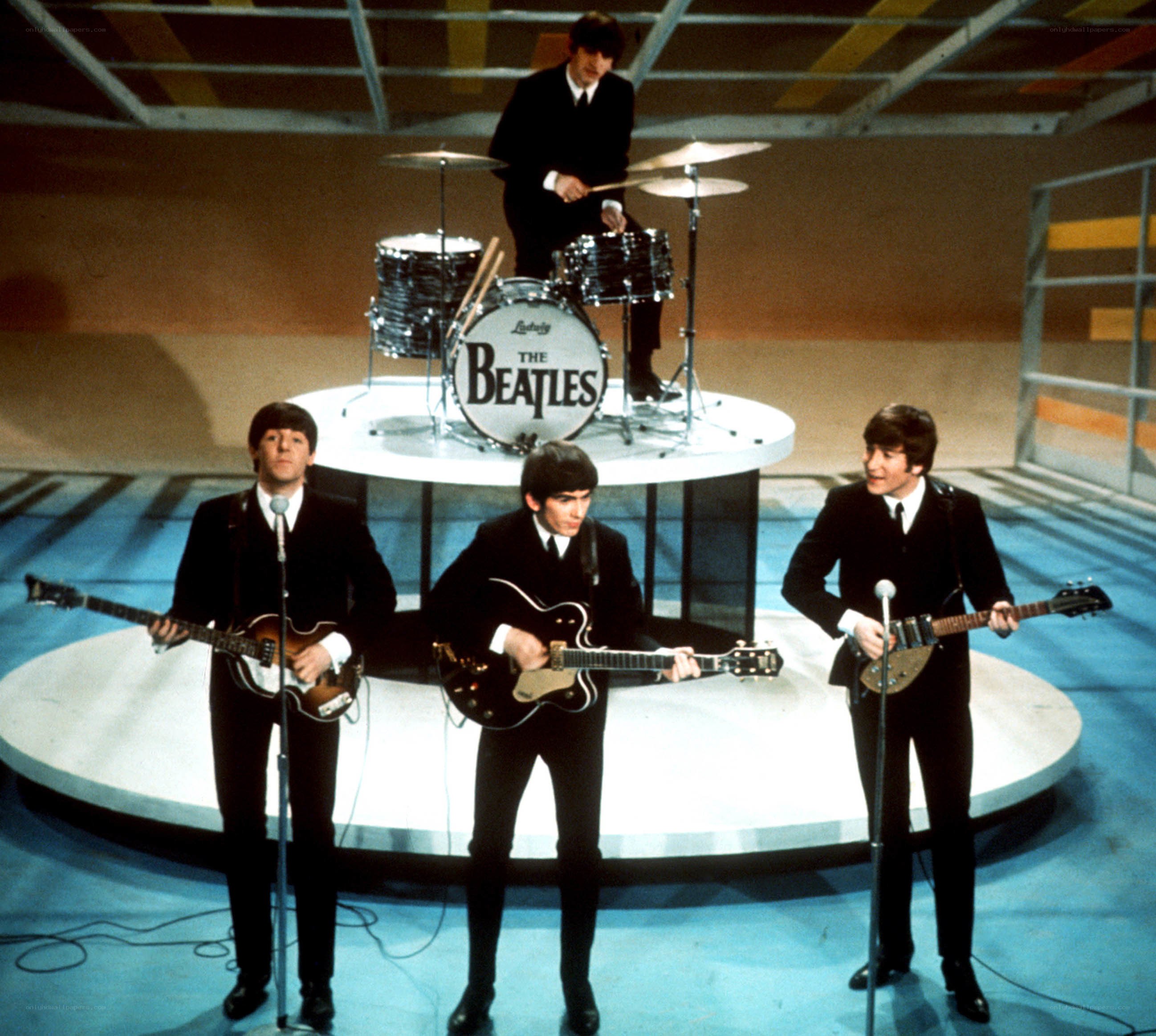 The Beatles performing on stage