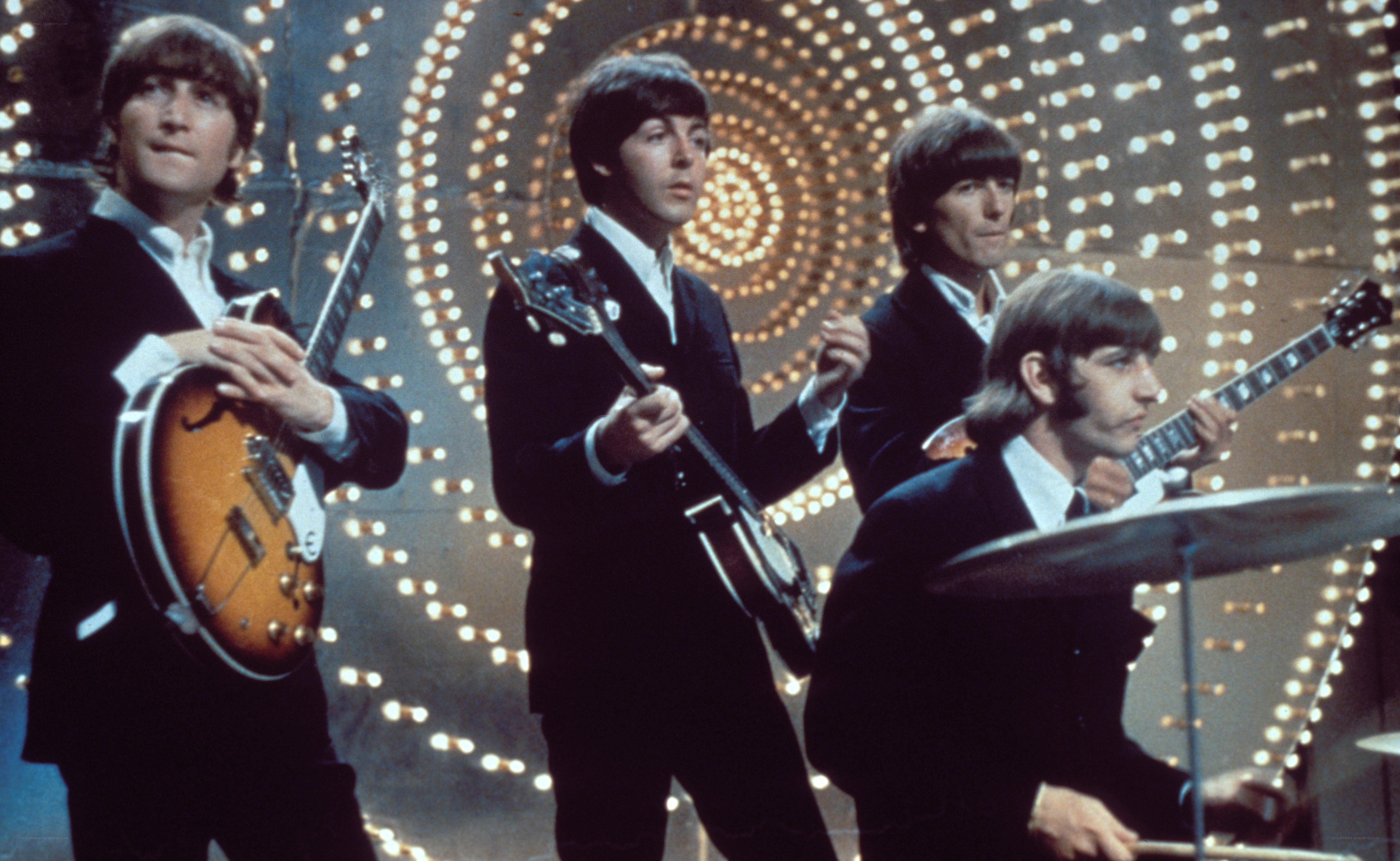 The Beatles performing on stage