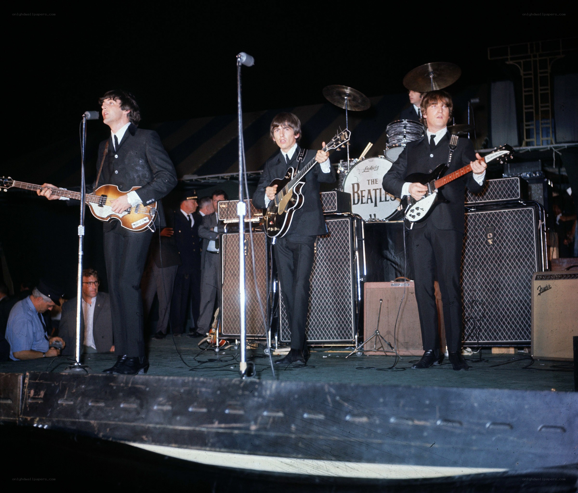 The Beatles performing on stage
