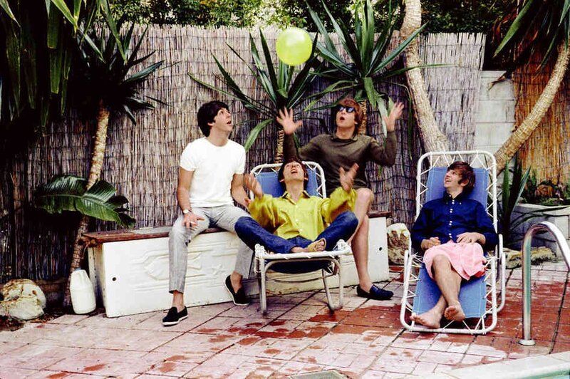 The Beatles playing with a balloon