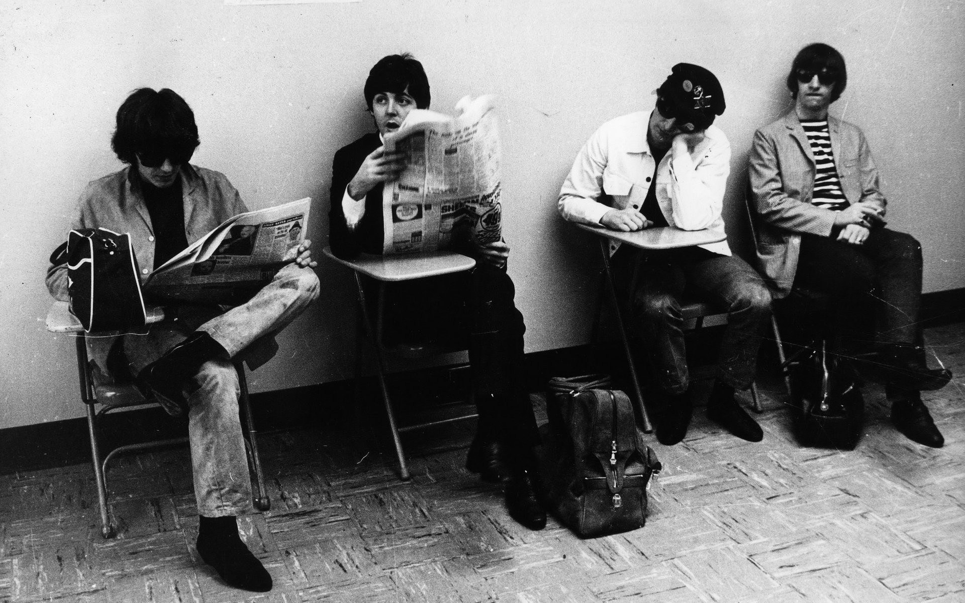 The Beatles waiting in a row