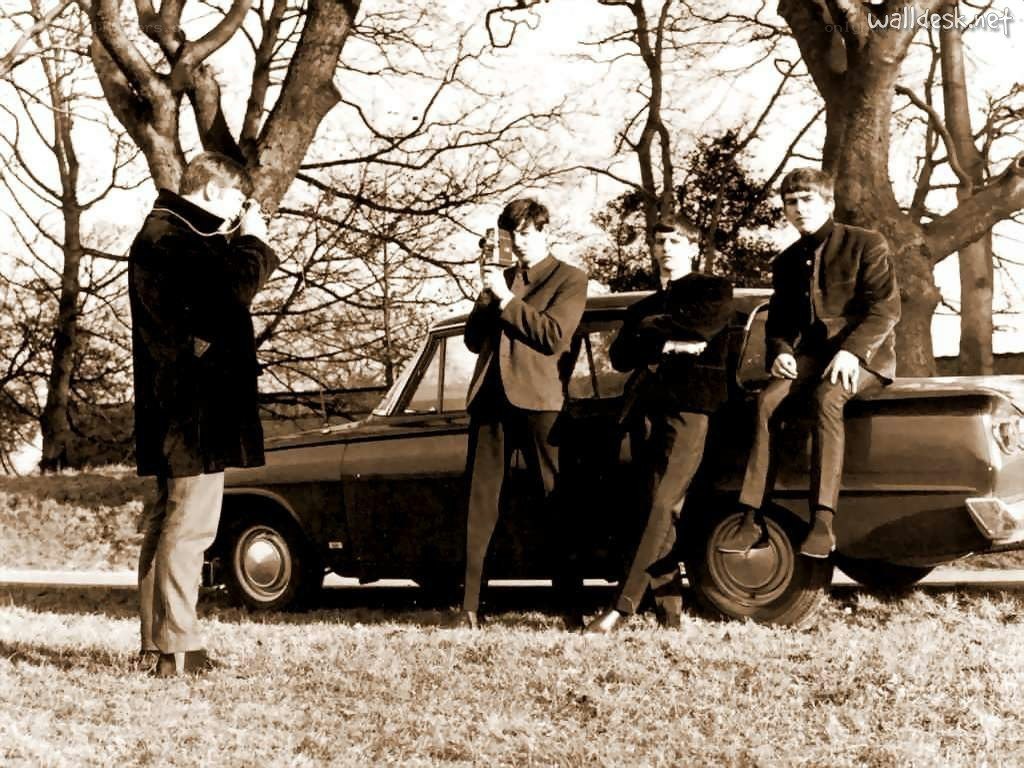 The Beatles with a car