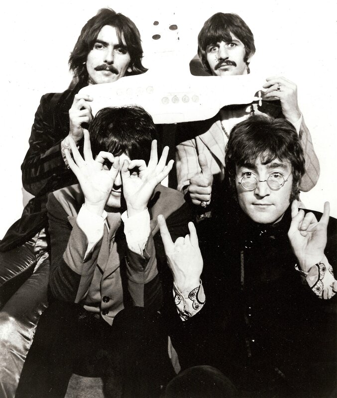 The Beatles with a model submarine