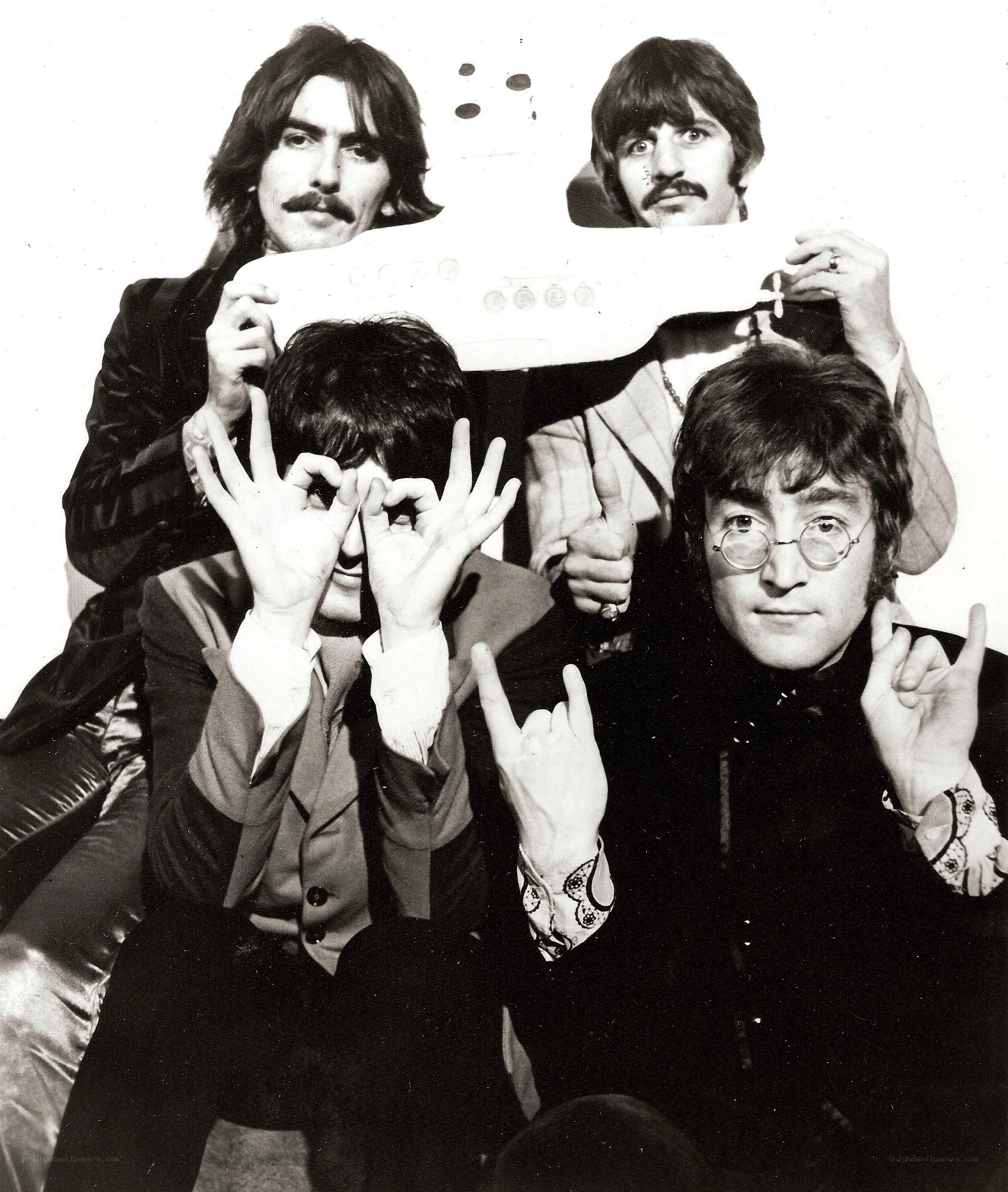 The Beatles with a model submarine