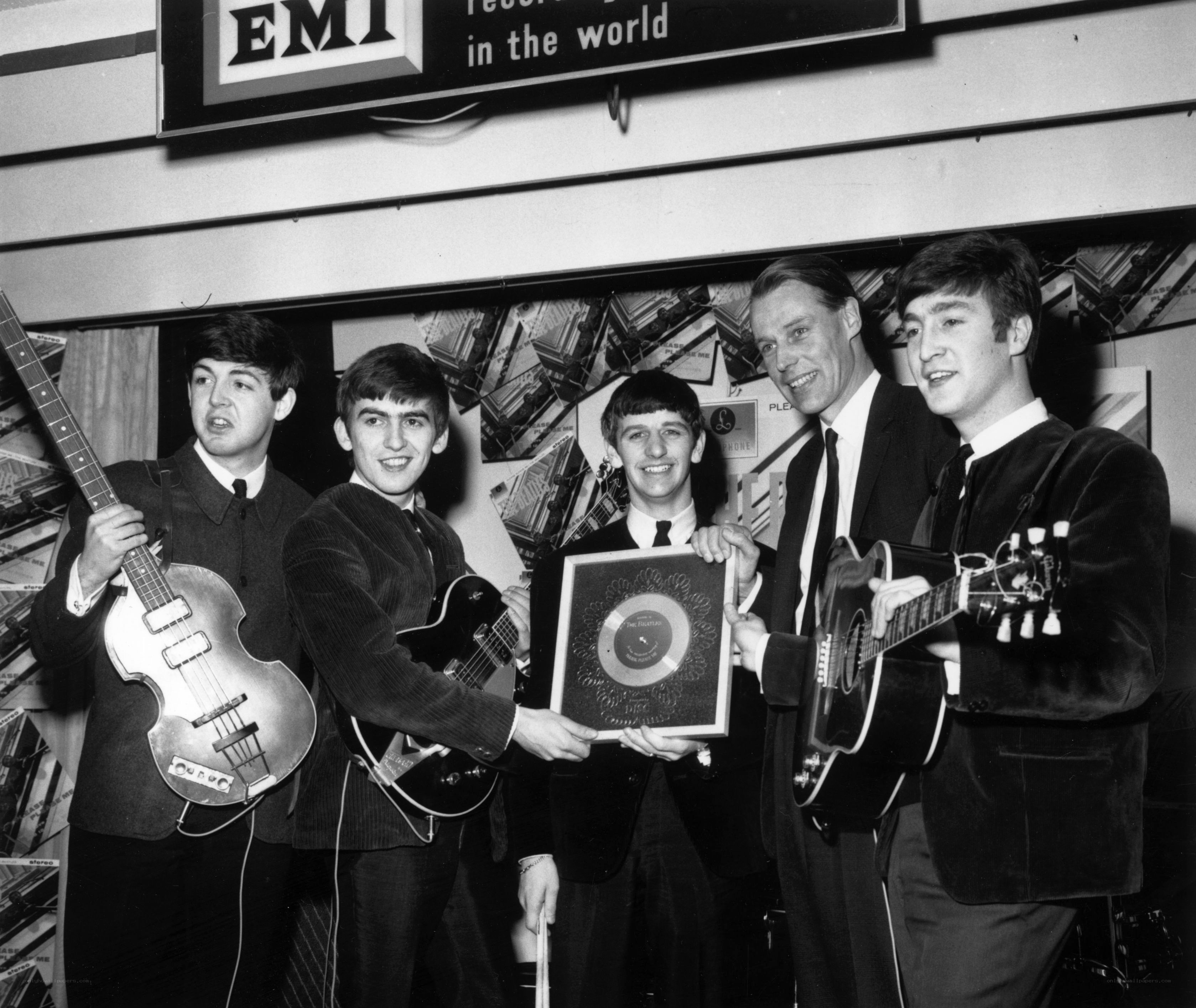 The Beatles with a record award