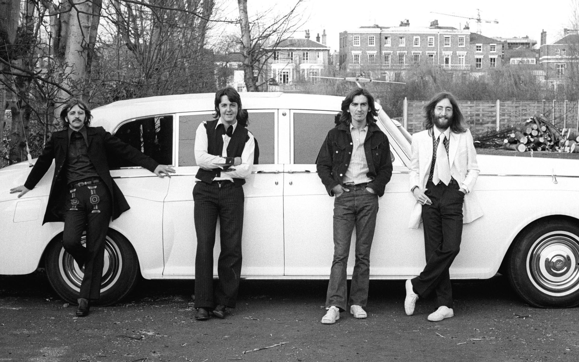 The Beatles with a white car