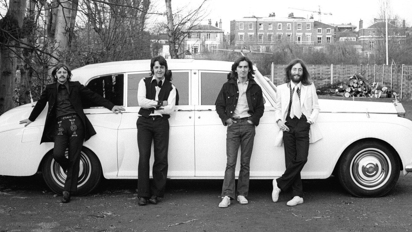 The Beatles with a white car