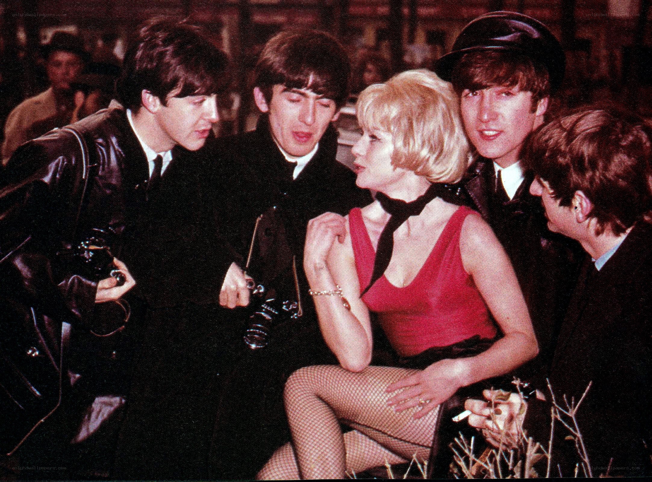 The Beatles with a woman