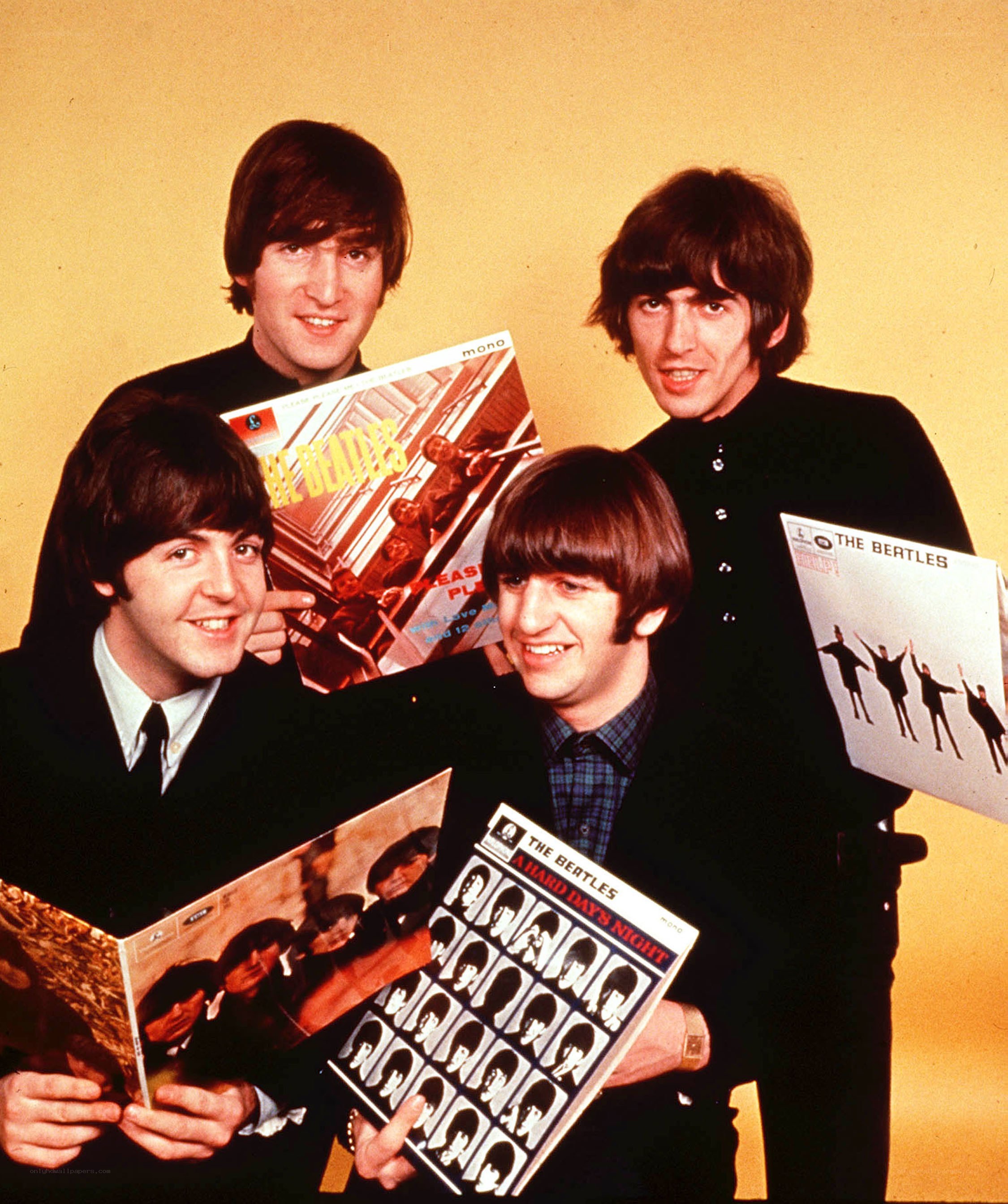 The Beatles with their albums