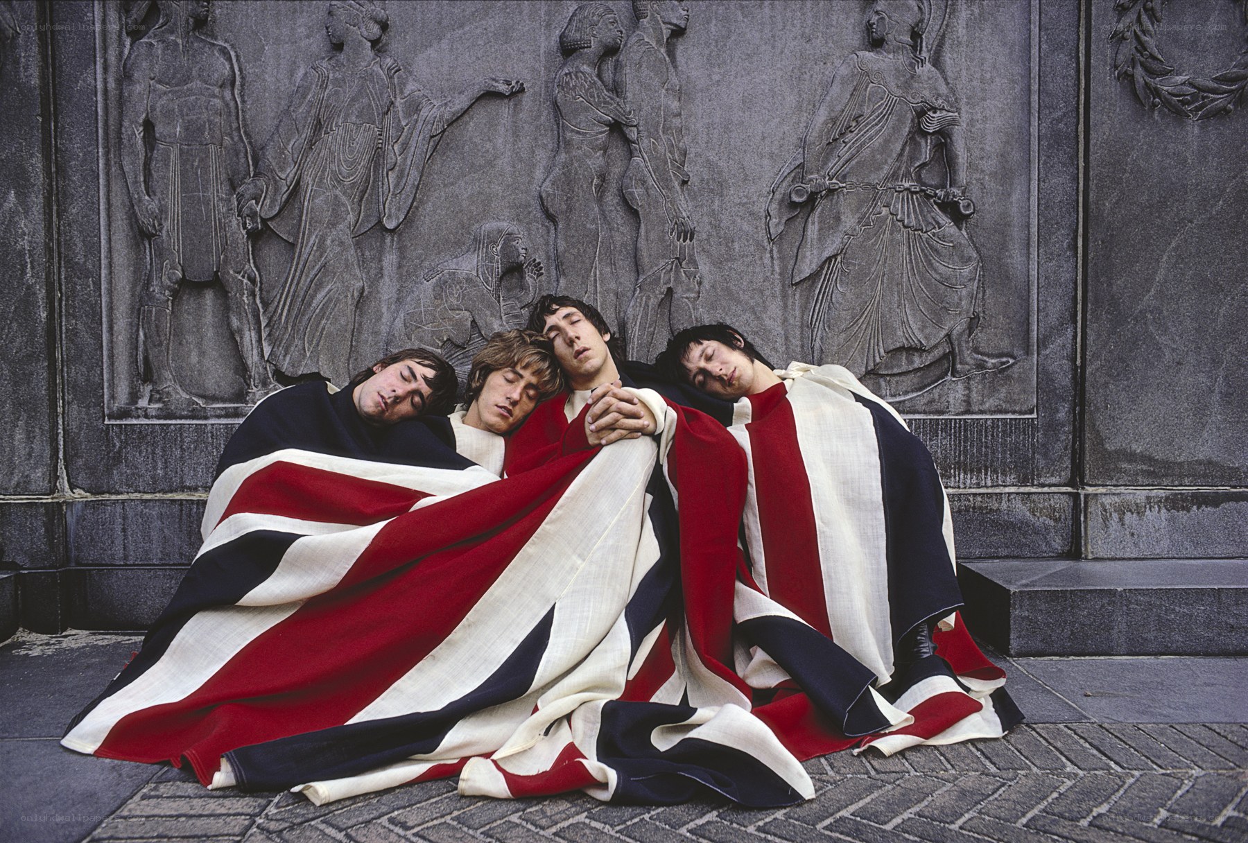 The Beatles wrapped in a flag