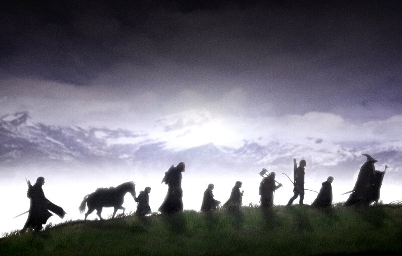 The Fellowship silhouetted at dawn