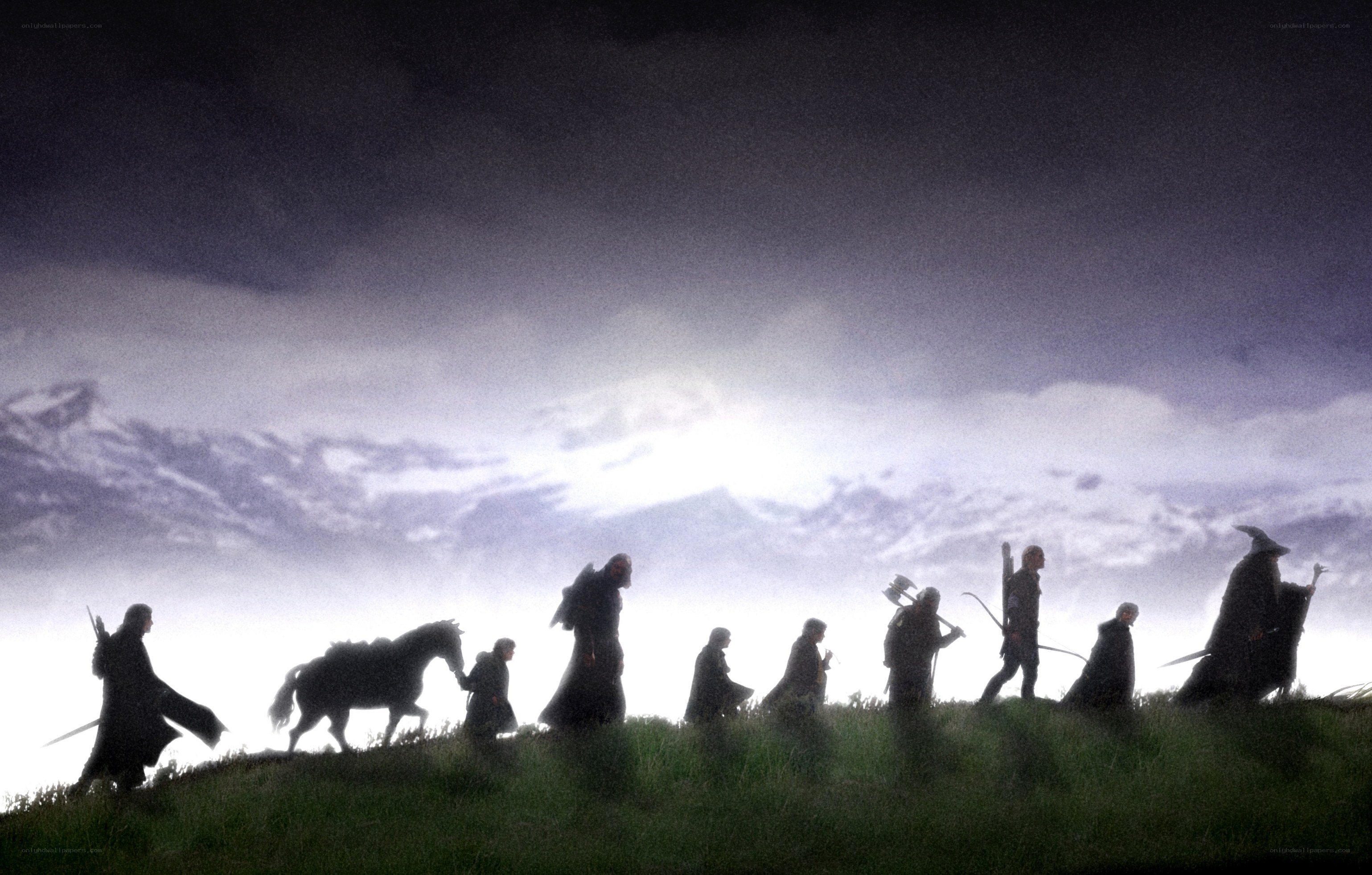 The Fellowship silhouetted at dawn