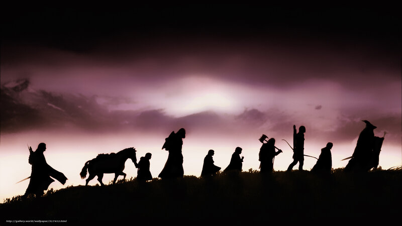 The Fellowship silhouetted at dusk