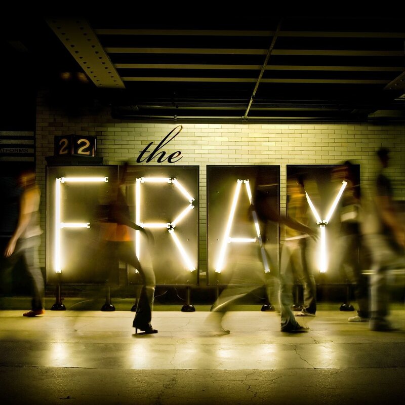 The Fray neon sign at subway station