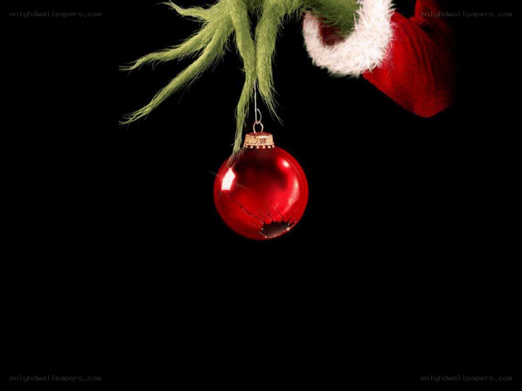 The Grinch with a red ornament