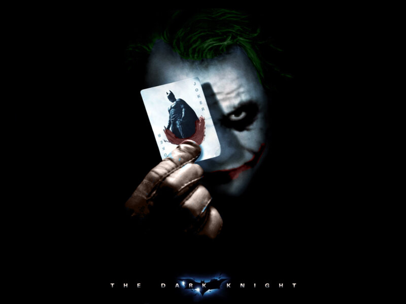The Joker holding a card