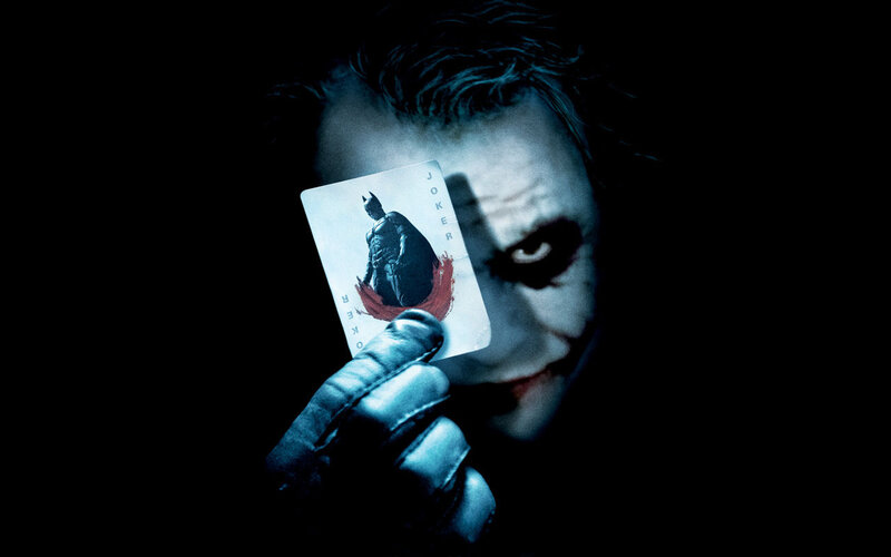 The Joker Holding a Card — Black, Dark, Night, Photograph