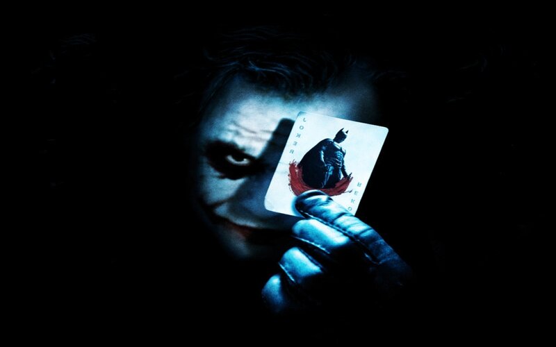 The Joker Holding a Card — Black, Dark, Night