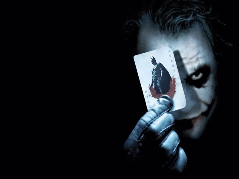 The Joker Holding a Card — Black, Dark