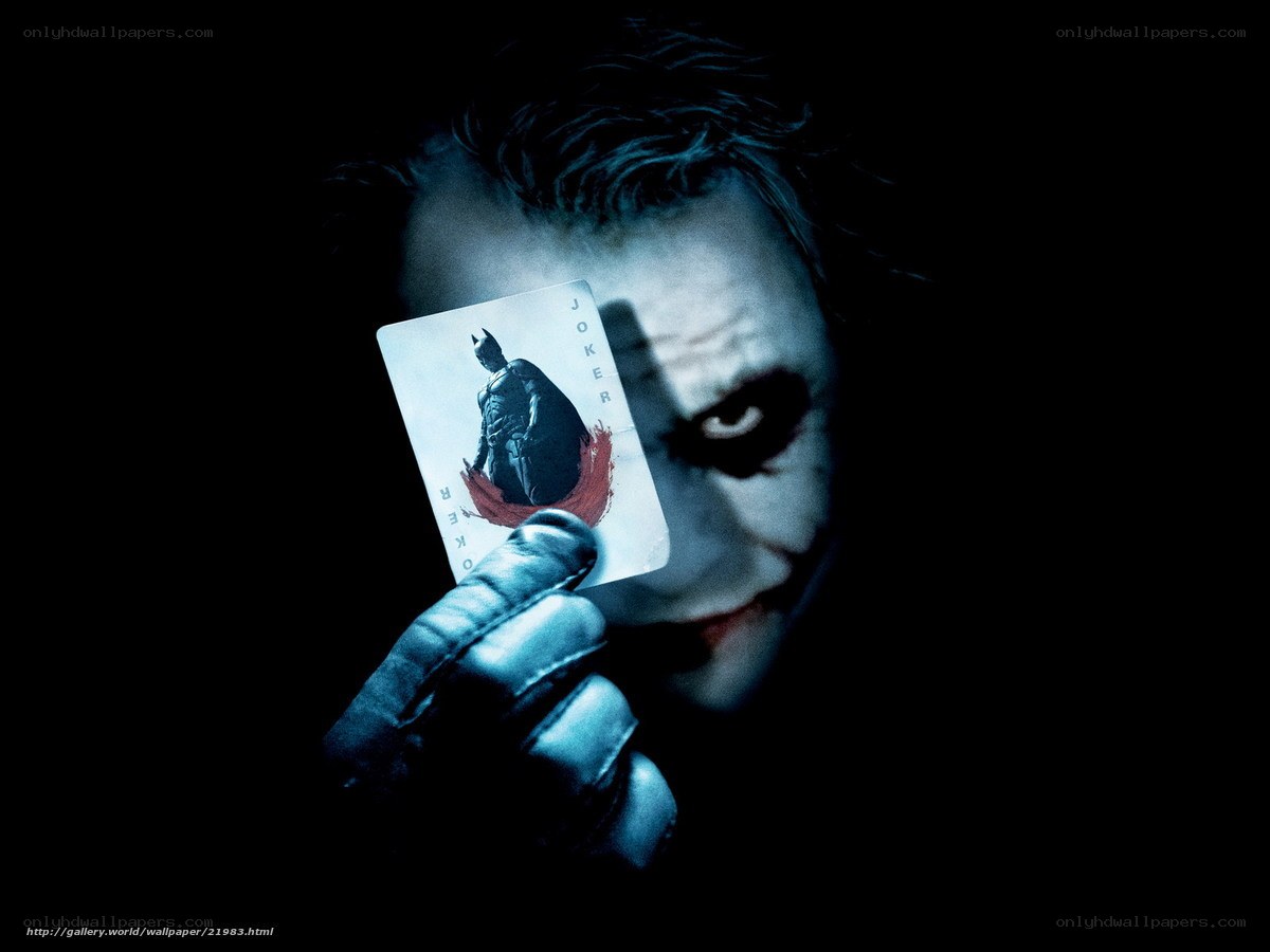The Joker holding a card