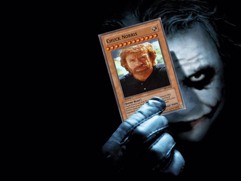 The Joker holding a Chuck Norris card