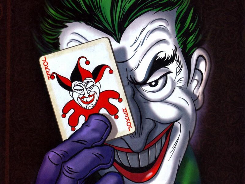 The Joker holding a joker card