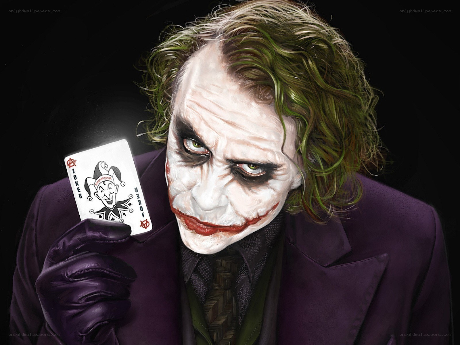 The Joker holding a playing card