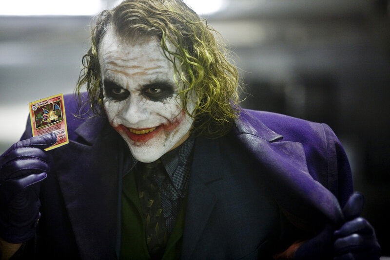 The Joker holding a Pokémon card