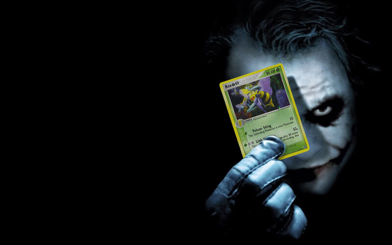 The Joker holding a Pokémon card