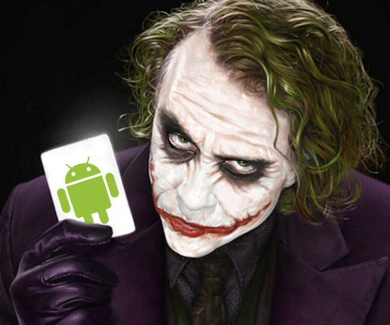 The Joker Holding Card