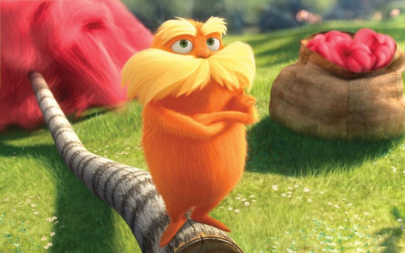 The Lorax standing on a log